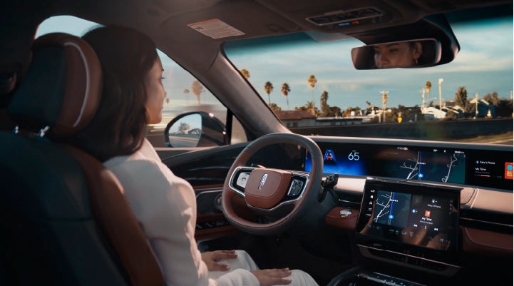 A person is shown driving hands-free on the highway with available Lincoln BlueCruise technology. | Hooks Lincoln in Fort Worth TX