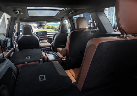 The interior of the 2025 Lincoln Aviator® SUV is shown with two seats folded down for added space. | Hooks Lincoln in Fort Worth TX
