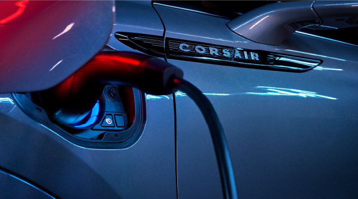 A charger plugged into the charging port of a 2025 Lincoln Corsair® Plug-in Hybrid model. | Hooks Lincoln in Fort Worth TX