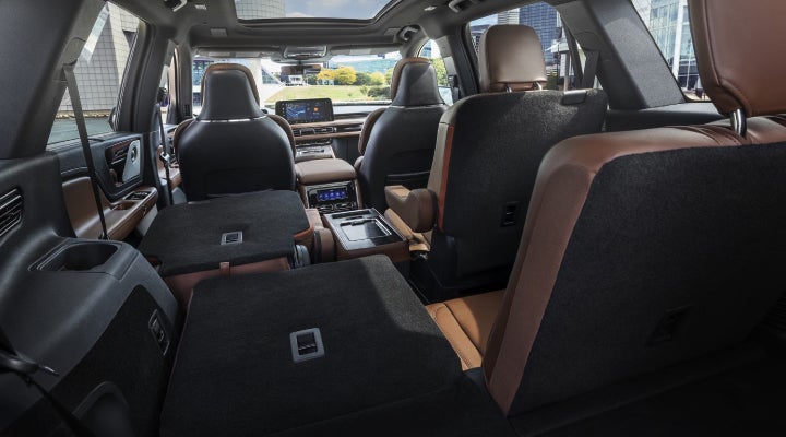 One side of the PowerFold® third-row seat and a second-row seat are folded forward in the 2026 Lincoln Aviator® SUV. | Hooks Lincoln in Fort Worth TX