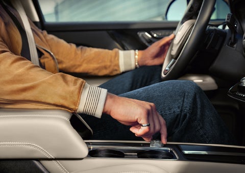 The driver of a 2026 Lincoln Corsair® SUV is shown selecting a drive mode. | Hooks Lincoln in Fort Worth TX