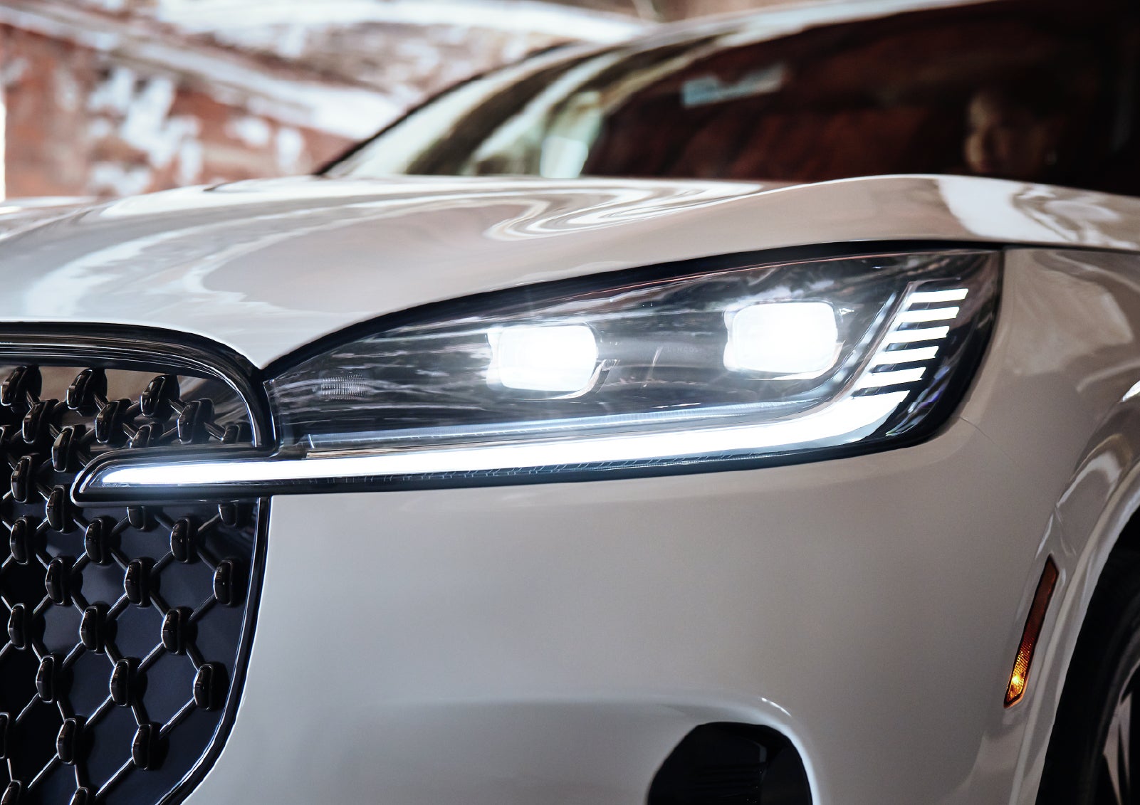 A close-up of a headlamp on the 2027 Lincoln Aviator® SUV is shown. | Hooks Lincoln in Fort Worth TX