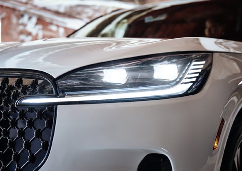 A close-up of a headlamp on the 2027 Lincoln Aviator® SUV is shown. | Hooks Lincoln in Fort Worth TX