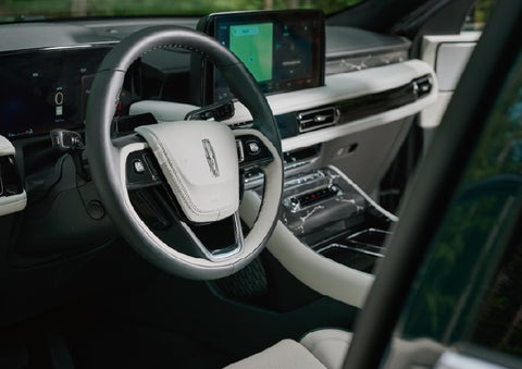 The leather-trimmed steering wheel of a 2027 Lincoln Aviator® Black Label™ SUV. | Hooks Lincoln in Fort Worth TX