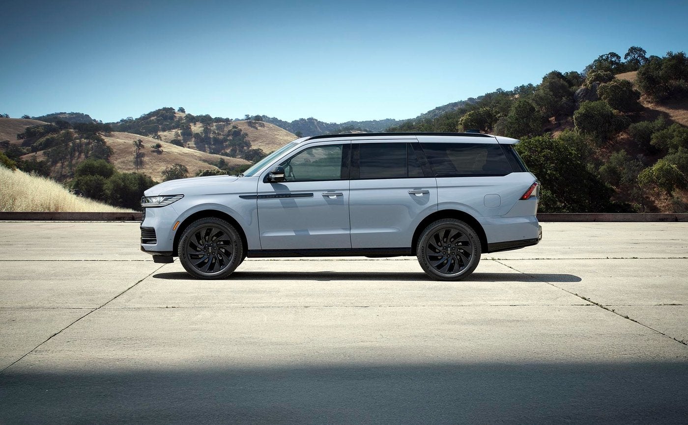 Light blue 2027 Lincoln Navigator in side profile with dark wheels for Fort Worth TX shoppers