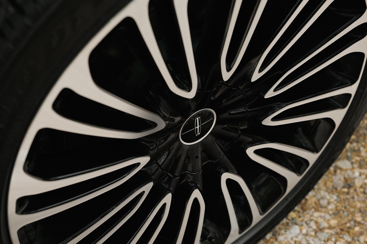 Close up of a Lincoln wheel, the view drivers see in front of the brakes, for Fort Worth TX brake service