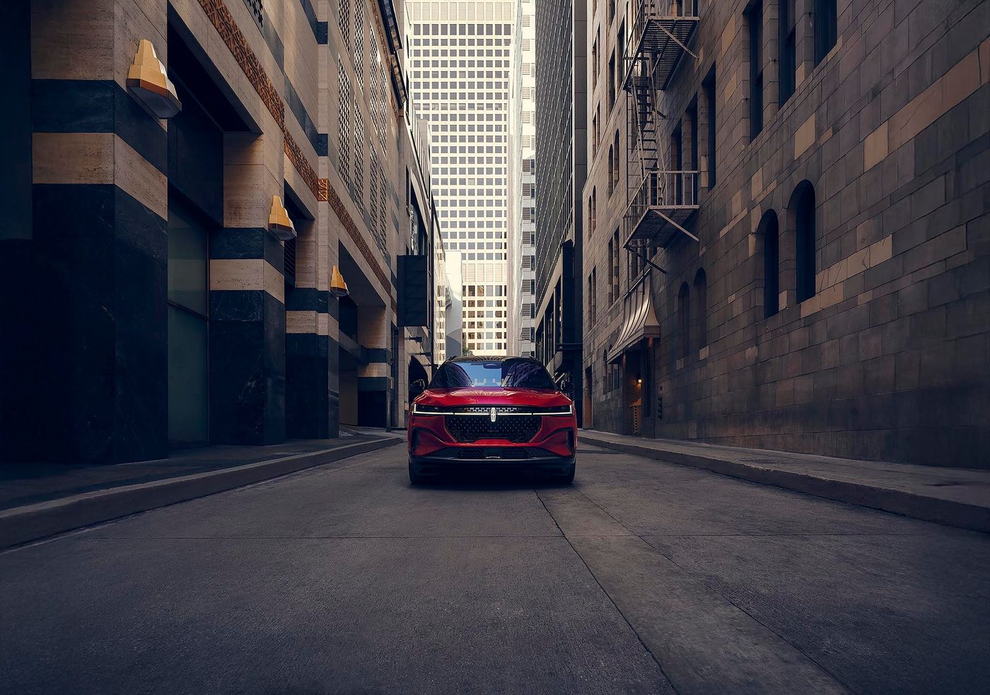 Red Lincoln Nautilus on a city street between tall buildings for Fort Worth TX shoppers